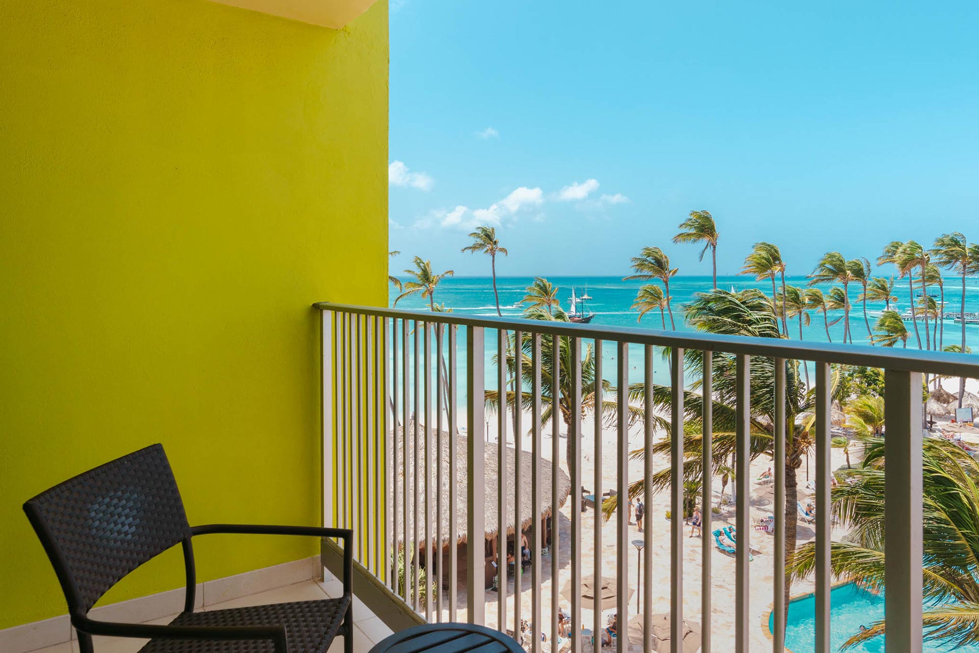 Balcony with a chair and an ocean view